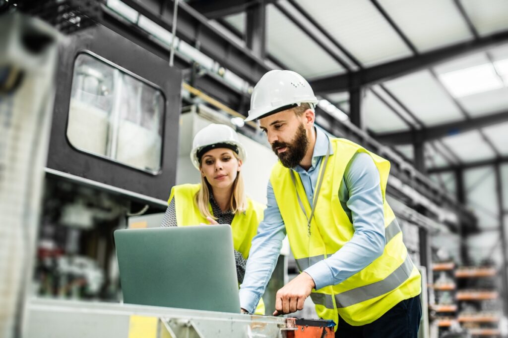 FMCG professional checking health and safety in manufacturing factory