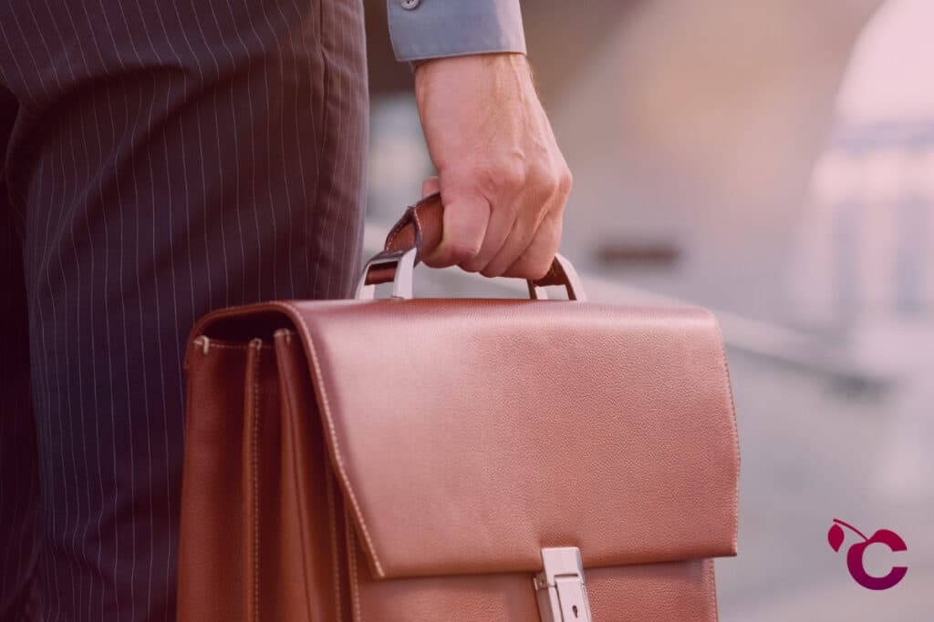 Finance professional holding briefcase applying for work and testing the job market