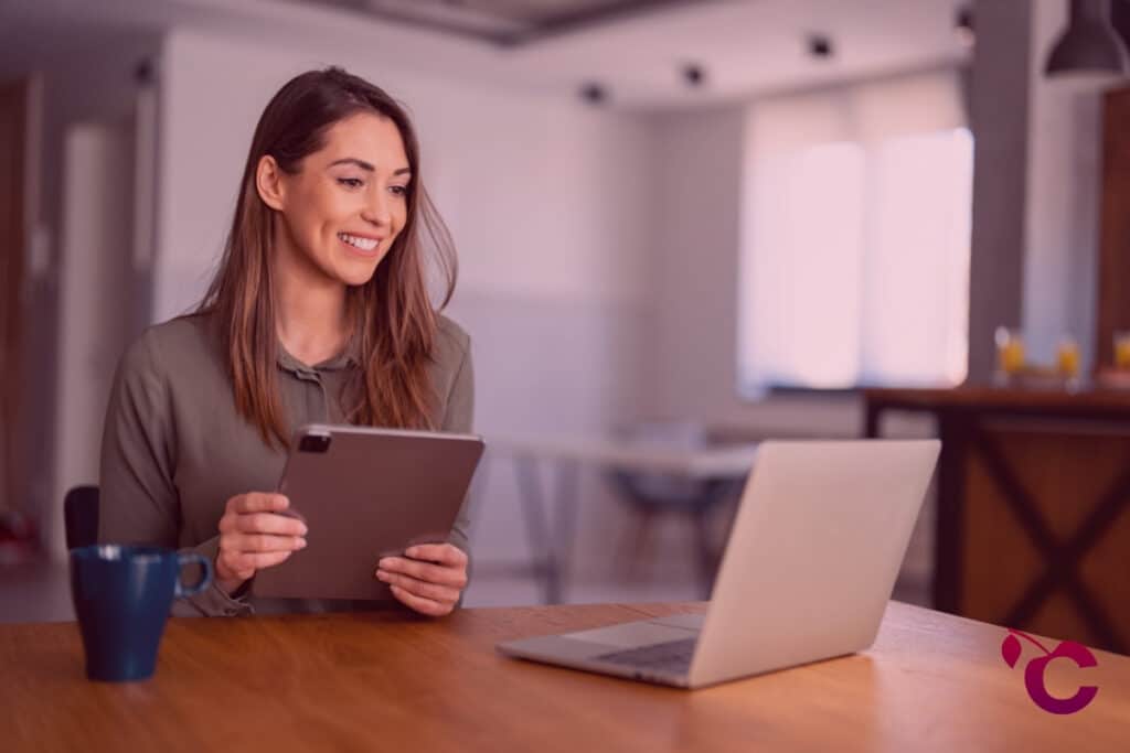 Confident executive in casual clothes using laptop computer to build habits as resilient leaders Confident executive in casual clothes using laptop computer to build habits as resilient leaders