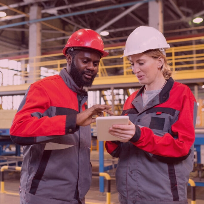 Engineering team working at manufacturing plant and discussing their skillsets