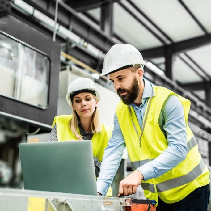 FMCG professional checking health and safety in manufacturing factory