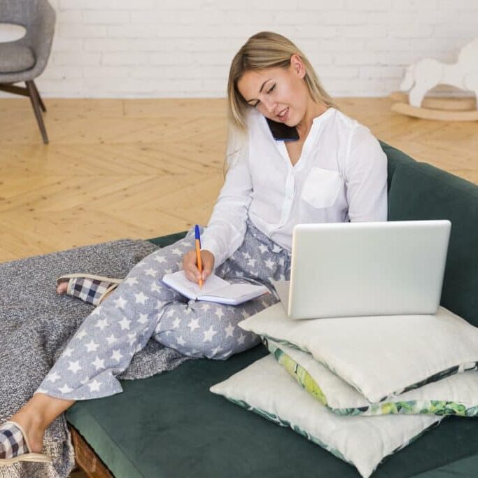 full-shot-woman-couch-working